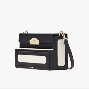 NWT Kate Spade piano shaped cross body bag.